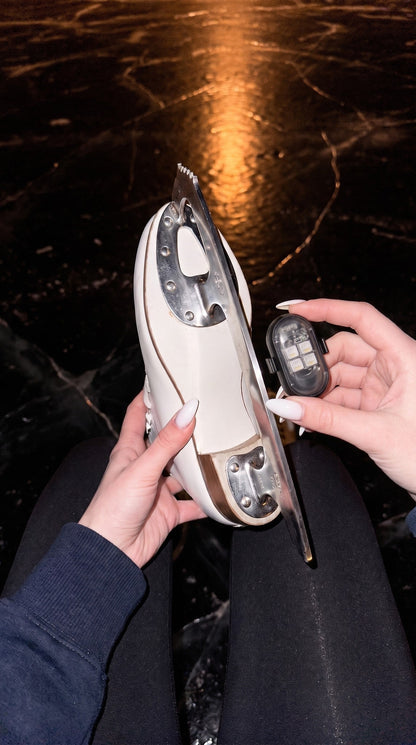 BladeLit LED pod held next to a figure skate